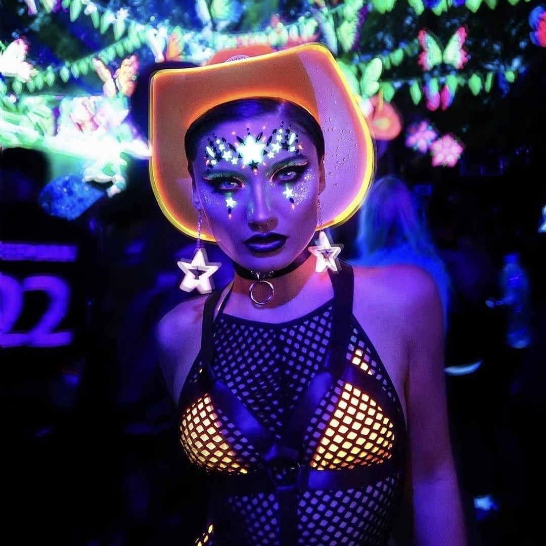 Orange LED space cowgirl hat with bright lights perfect for futuristic party outfits electronic dance festivals and western costume fashion