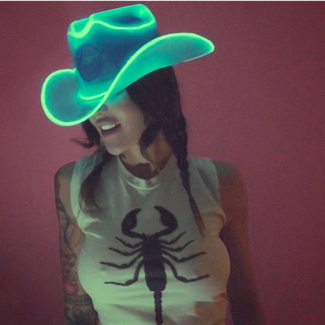 Green cowgirl hat glowing with LED lights for fishnet festival outfits rave party fashion and western costume celebrations