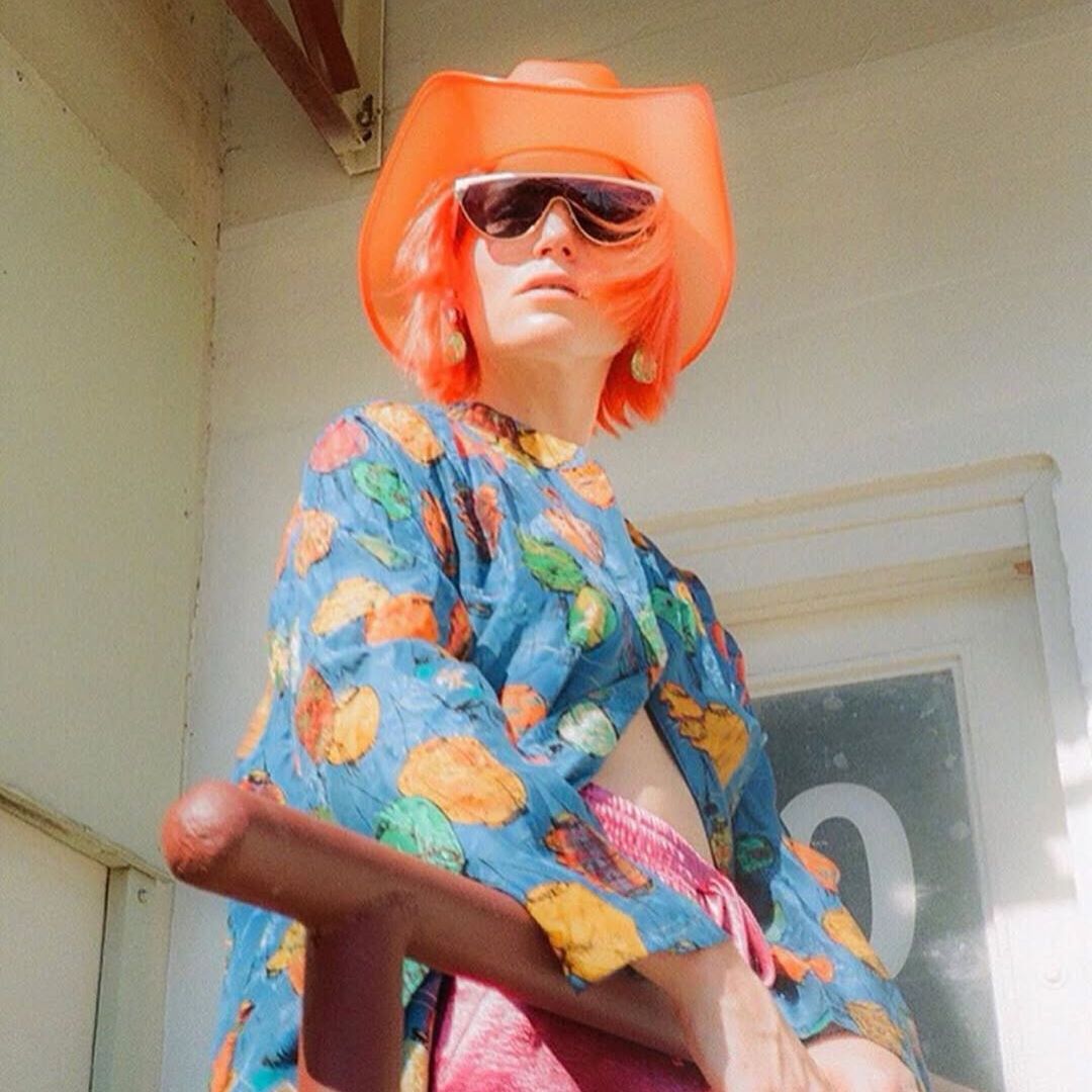 Orange neon cowgirl hat glowing with LED lights for Austin music festivals Texas country concerts and western costume party fashion