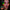 Woman wearing green and red LED cherry face stickers - Glowing fruit-shaped facial jewelry for music festivals, Y2K aesthetics, cherry makeup trends, and TikTok content creation