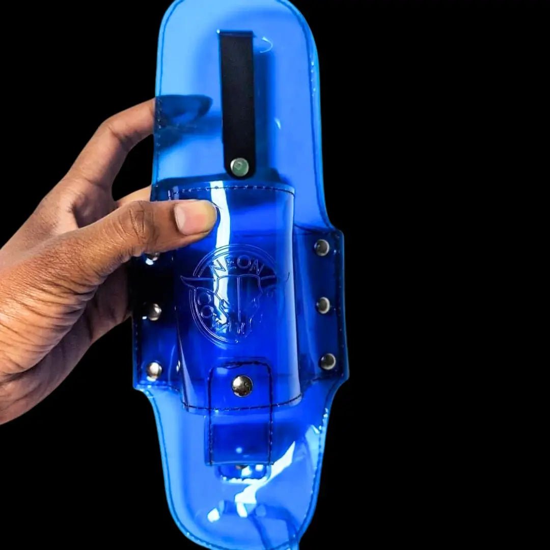 Person holding blue festival drink holster showing how it securely holds 12oz bottle for hands-free concert experience