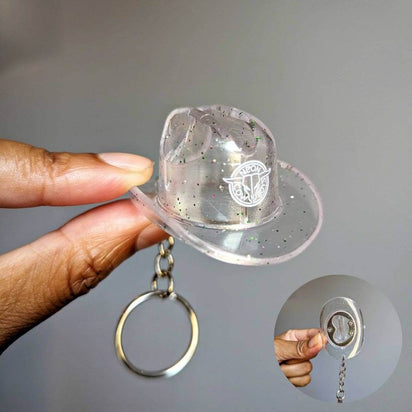 Clear transparent cowboy hat bottle opener keychain showing functional design for music festival accessories