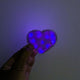 Blue LED heart fuzzy hair clip held in hand - Illuminated kawaii hair accessory for anime conventions, K-pop concerts, clubbing outfits, and Valentine's Day celebrations