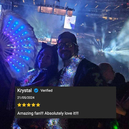 Customer review showing blue LED feathered fan in crowd setting - Verified buyer testimonial of illuminated feather accessory at music festival, concert venue, nightlife event, and dance party