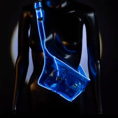 Blue illuminated fanny pack against dark background demonstrating vibrant glow effect for nighttime events and outdoor concerts