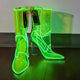 Neon green illuminated transparent boots creating vibrant glow effect ideal for rave outfits nighttime events and glow parties