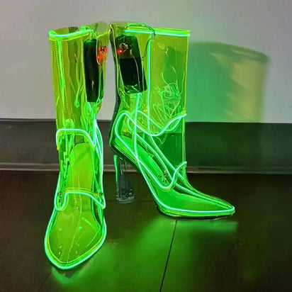 Neon green illuminated transparent boots creating vibrant glow effect ideal for rave outfits nighttime events and glow parties