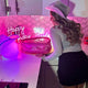 Pink LED Cowboy Hat with Birthday Cake - Woman Celebrating with Light Up Western  Cowgirl Hat - Birthday Queen Night-time Celebration Party - Space Cowgirl Themed Bachelorette Birthday Sorority Event
