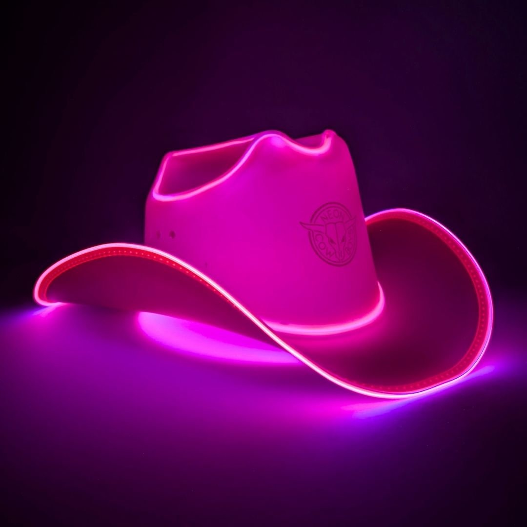 hot pink space cowgirl LED hat lifestyle product shot perfect for space cowgirl costume parties neon accessories sci-fi themed events cosmic Halloween outfits
