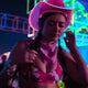 space cowgirl party pink hat glowing perfect for rooftop party fashion urban nightlife accessories city celebration themes skyline photography