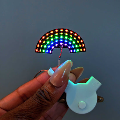 Rainbow shaped LED face sticker with colorful light-up dots pattern for festivals temporary makeup jewelry accessory easy to apply for birthday celebrations, edm festivals, lollapalooza