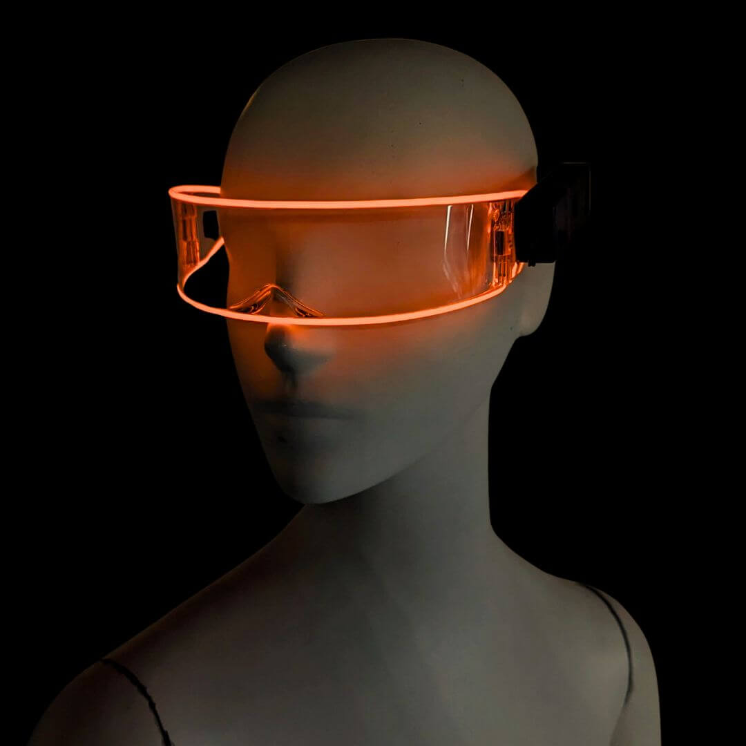 Orange illuminated transparent cyber glasses in studio - Glowing futuristic eyewear for Halloween parties, retro-futuristic fashion shoots, electronic music festivals, and corporate tech events