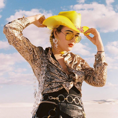 Yellow cowgirl hat with LED lights glowing for Nashville honky tonk parties western costume celebrations and country fashion