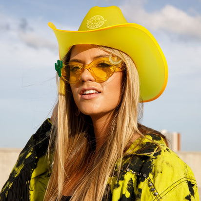 Yellow cowboy hat glowing bright with LED lights for masculine country bar parties western themes and music fashion