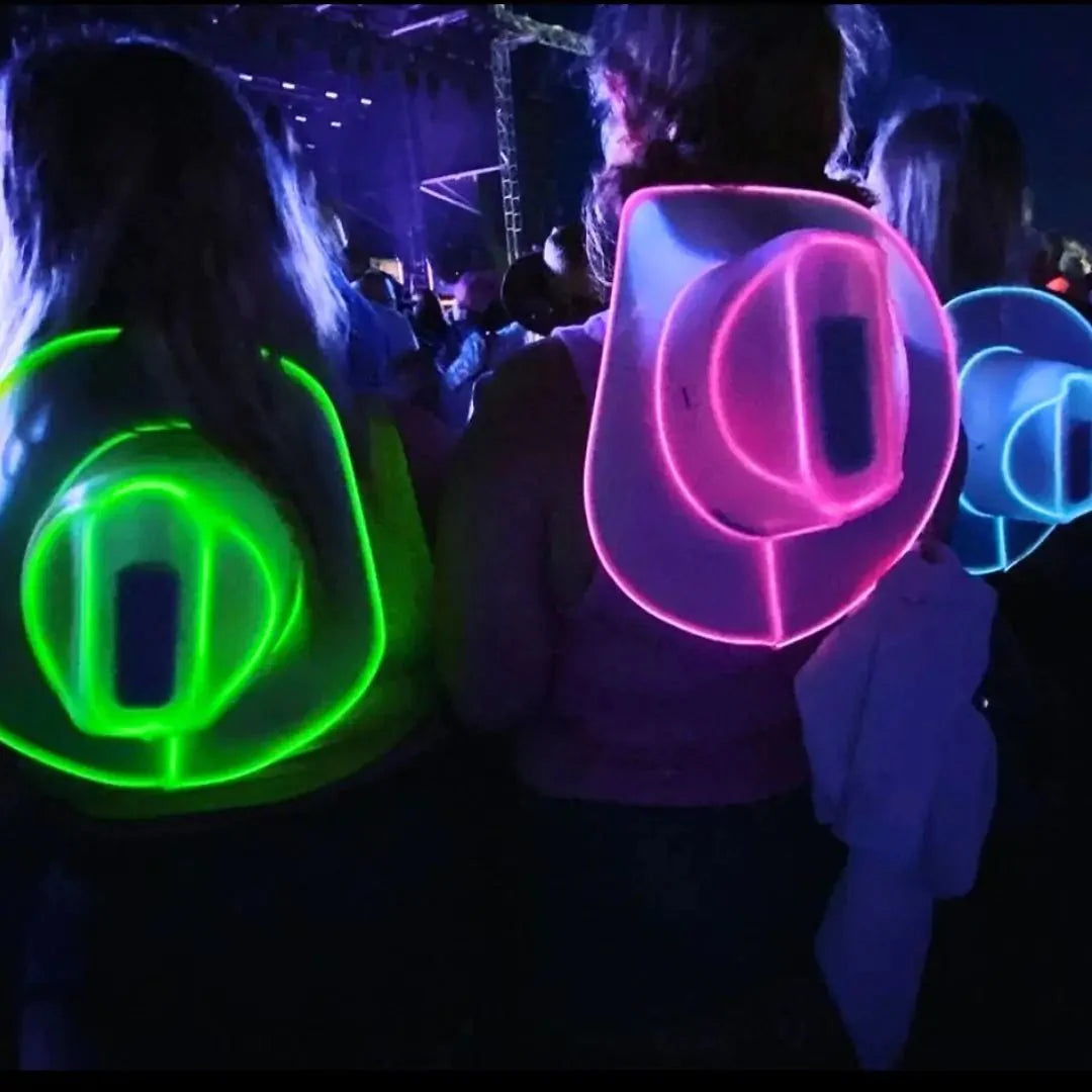 Group of women in nightclub wearing LED cowboy hats - Glowing green and blue western headwear for nightlife events, ladies' nights, birthday celebrations, casino parties, and bachelor/bachelorette gatherings