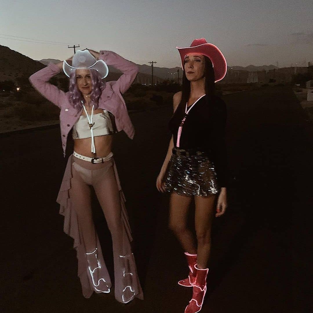 White pink LED space cowgirl hats glowing bright for female friends matching party costumes festival outfits and celebration accessories
