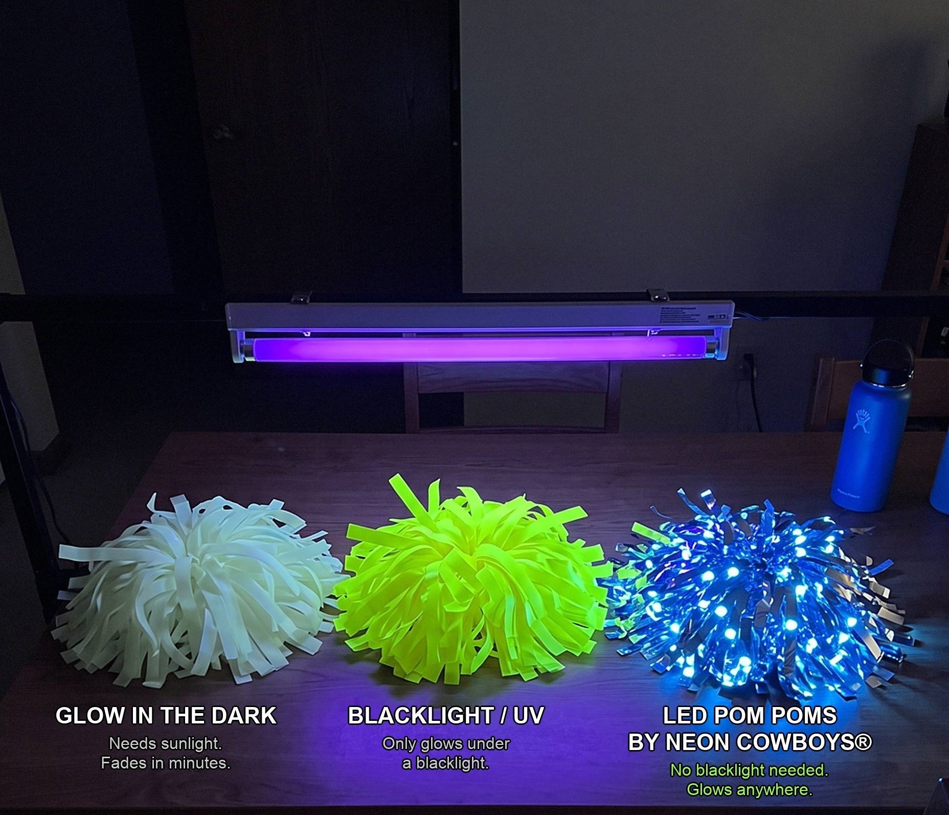 Glow in the dark, blacklight UV and LED pom poms side by side under a blacklight — only the Neon Cowboys LED pom poms stay lit without UV.