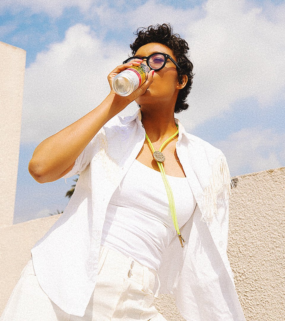 Asia Hall, Founder of Neon Cowboys, wearing Topo Chico Bolo Tie
