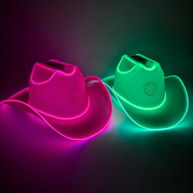 Pink green LED cowboy hat 2-pack bundle, two glowing hot pink and green light up cowboy hats on a dark studio backdrop, neon cowboy hat set perfect for matching outfits, couples costume parties, best friend celebrations, rave and music festival looks, Neon Cowboys