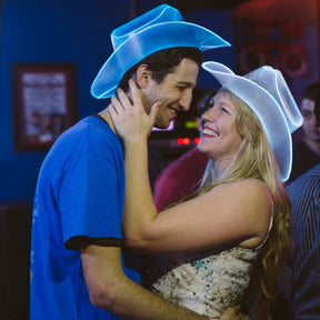 Blue white LED neon cowgirl hats glowing bright for couple line dancing honky tonk country western bars