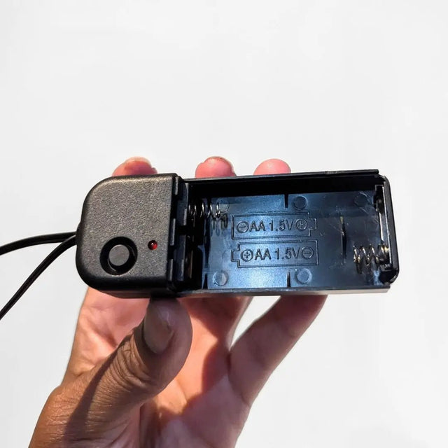 Two Prong Inverter connected to smartphone - Battery pack powering LED star crossbody purse with easy connection interface