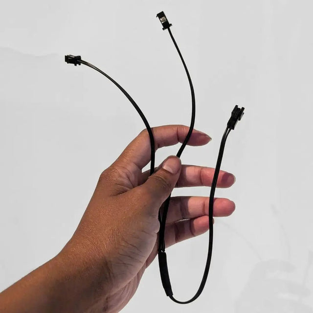 Hand holding Two Prong Splitter cable with black connecting wires - Essential accessory for connecting multiple light-up Western belt components