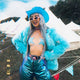 Blue neon cowgirl hat with LED lights ideal for couples photoshoot styling romantic fashion and western costume outfits
