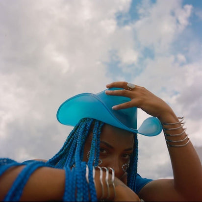 Blue neon cowgirl hat glowing perfect for concert performance stages music festival fashion and western costume outfits