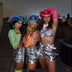 Group of women wearing silver outfits and colorful LED cowboy hats - Trendy light-up western headwear for bachelorette parties, concerts, birthday celebrations, themed bar crawls, and dance performances