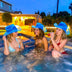 Blue glowing LED neon cowboy hat 3-pack bundle ideal for girls night out bachelorette parties and group celebrations in a hot tub pool party laughing in nashville city
