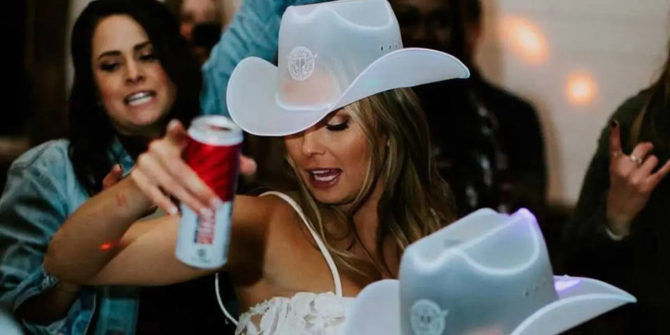 white neon cowgirl bridal wedding bachelorette party at a ranch barn wedding in Nashville Tennessee dallas texas or country city for a reception dance