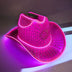 Pink rhinestone LED cowboy hat in purple lighting - Premium illuminated designer piece for runway shows, fashion photography, album covers, and celebrity stylists