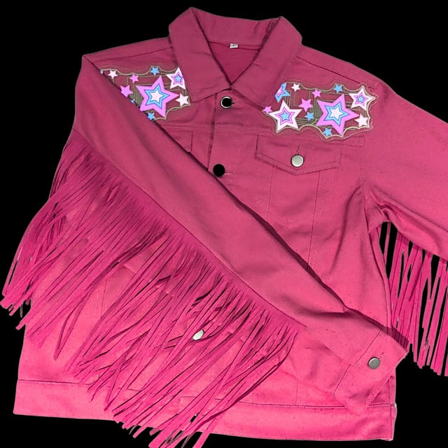 Animated Starlight Jacket with Fringe, flat-lay of a pink denim fringe jacket with LED light-up star patches on the shoulders, an led fringe jacket and light up jacket for festival dancers and drag performers, ideal for raves, Coachella and music festivals, Neon Cowboys