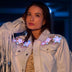 Animated Starlight Jacket with Fringe, close-up of the white fringe jacket shoulders with glowing LED light-up stars on a model, an led costume and light up jacket for burlesque and drag performers, ideal for raves, music festivals and Pride, Neon Cowboys