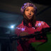 Animated Starlight Jacket with Fringe, model on a motorcycle in a pink LED star fringe jacket and glowing purple light-up bandana at night, an led fringe jacket and light up jacket stagewear for festival dancers, raves and EDM concerts, Neon Cowboys
