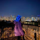 Blue LED neon cowgirl hat with lights glowing for cityscape rooftop parties urban events and western costume celebrations