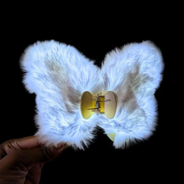 Blue fuzzy butterfly hair clip close-up showing attachment clip - Detailed view of illuminated hair accessory displaying gold butterfly center for cosplay events, anime conventions, and 90s themed gatherings