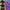 JT from City Girls wearing custom light up belt buckle with purple hair and checkered outfit during music video showcasing trending festival fashion accessories