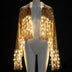 Gold LED light up sequin fringe jacket glowing on a mannequin with warm white LED fringe on black, a led sequin fringe jacket and disco cowgirl jacket, a glowing performance outfit and stagewear for go-go dancers, drag, cabaret and burlesque performers at music festivals, raves and EDM concerts, Neon Cowboys