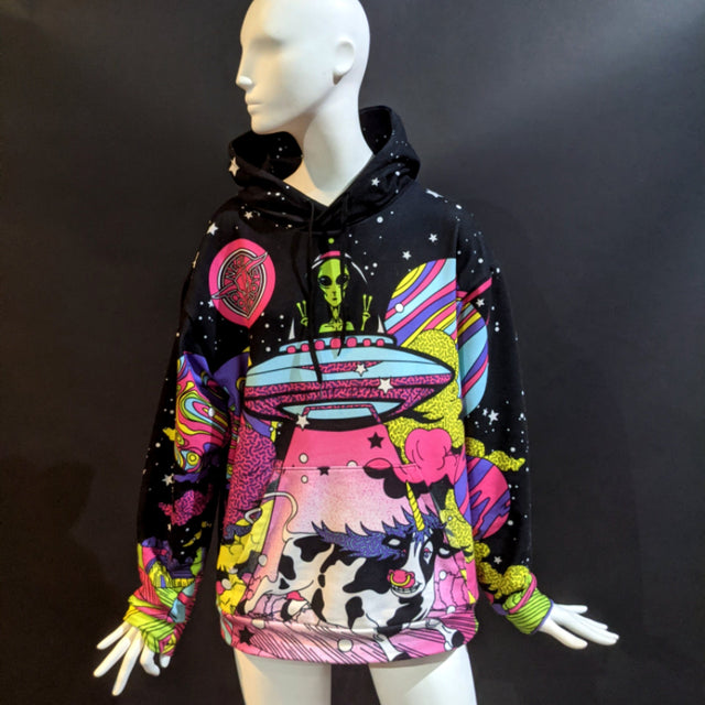 Front view of Day at the Farm hoodie on woman showing colorful UFO cow design ideal for music festival fashion and eye-catching Area 51 streetwear styles