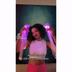Woman in pink light up WANTED choker necklace at Coachella music festival outfit accessory that glows for perfect nighttime concert wear and bachelorette party celebrations with friends