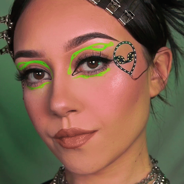 Woman with cyberpunk LED face sticker on cheek - Illuminated facial accessory for space-themed events, Mardi Gras celebrations, concert outfits, and theatrical performances