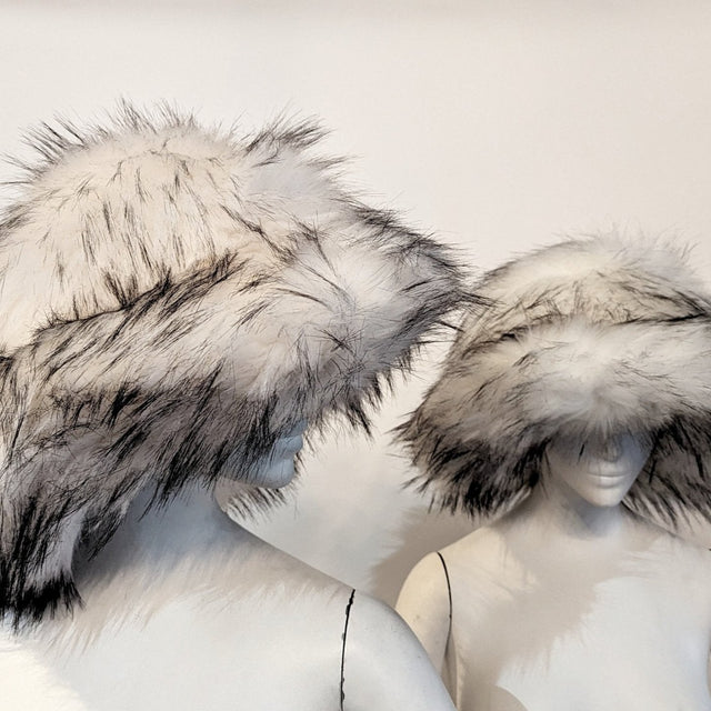 Woman wearing white furry bucket hat without LED illumination - Non-illuminated version showing soft polyester texture and natural daytime appearance for everyday fashion and casual winter wear