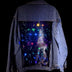 Universe Galaxy LED Panel Detail on Denim Jacket - Close-Up of Light Up Back Design - Color Changing Starry Effect on Jean Jacket - Fashion Technology Brand Neon Cowboys - Space Cowgirl Outfit for Fun Night Out - Glow Event Party