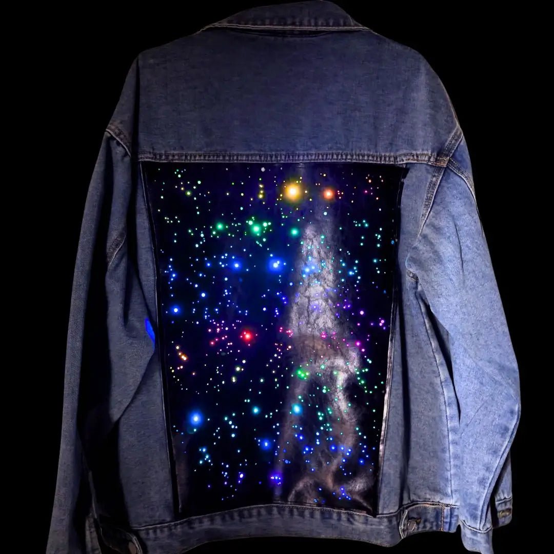 Universe Galaxy LED Panel Detail on Denim Jacket - Close-Up of Light Up Back Design - Color Changing Starry Effect on Jean Jacket - Fashion Technology Brand Neon Cowboys - Space Cowgirl Outfit for Fun Night Out - Glow Event Party