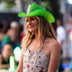 Woman in a bright green LED light-up cowboy hat and star bustier outdoors, a green led neon cowboy hat and glow in the dark cowgirl hat for western costume fashion, raves, music festivals, country concerts and bachelorette parties, Neon Cowboys