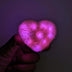 Pink LED heart fuzzy hair clip held in hand - Illuminated kawaii hair accessory for sweet sixteen parties, date nights, princess-themed events, and social media content creation