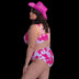 Woman wearing pink cow print high-waisted bikini set with cowboy hat creating perfect festival summer outfit for beach parties and outdoor music events with unique western style fashion