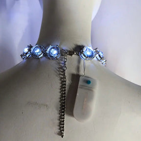 Back view of blue LED chunky rhinestone necklace showing comfortable clasp and battery pack design perfect for all-night wear at weddings and special events