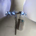 Back view of blue LED chunky rhinestone necklace showing comfortable clasp and battery pack design perfect for all-night wear at weddings and special events